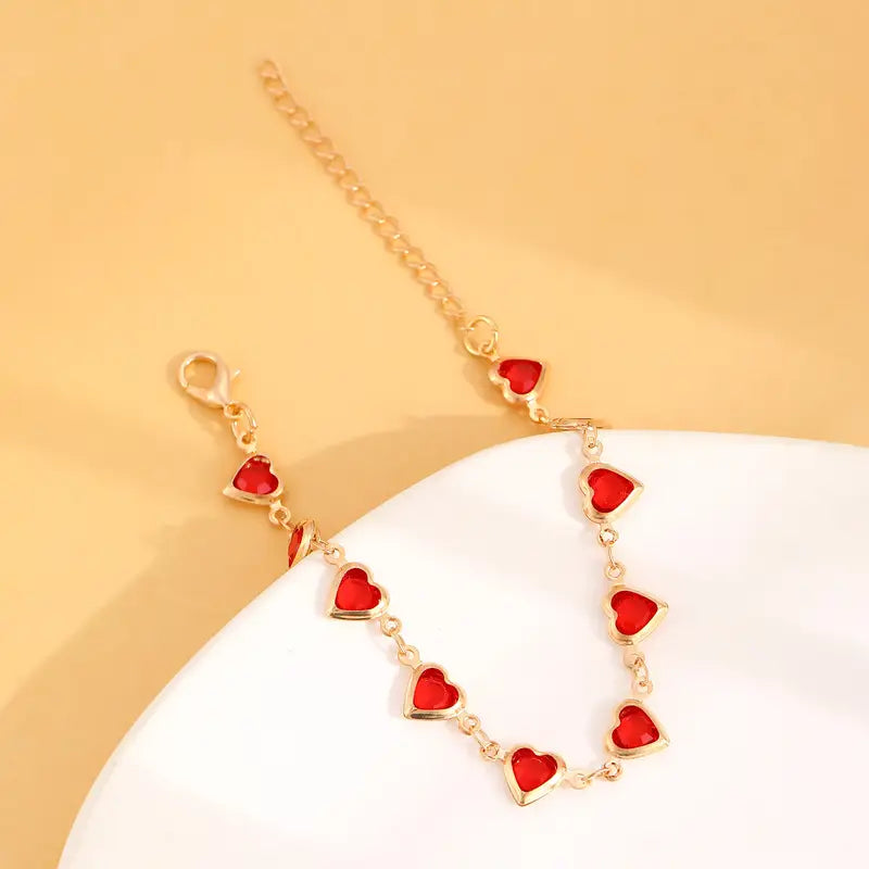 Pulsera de corazón de rubí en oro