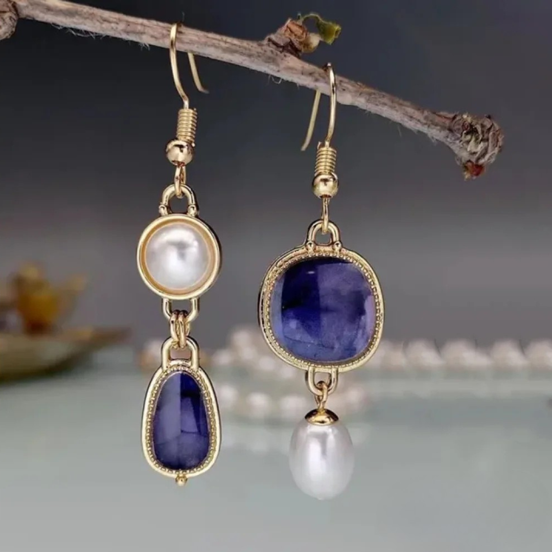 Pendientes elegantes con piedra azul y perla