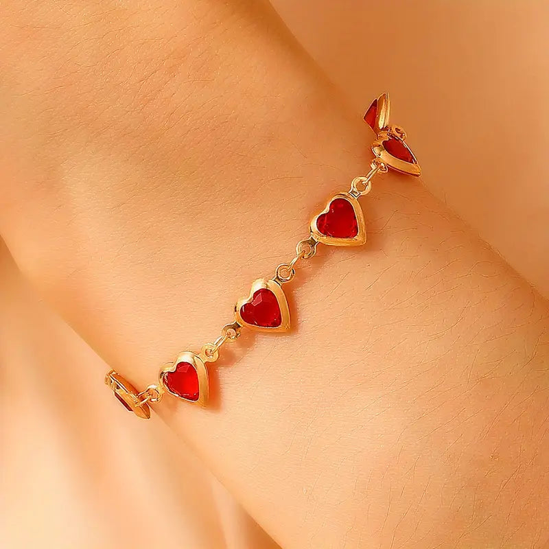 Pulsera de corazón de rubí en oro