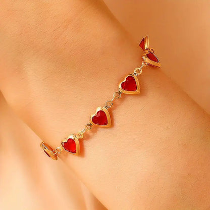 Pulsera de corazón de rubí en oro
