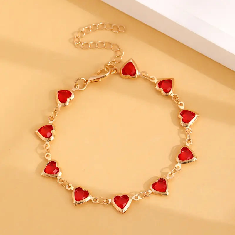 Pulsera de corazón de rubí en oro