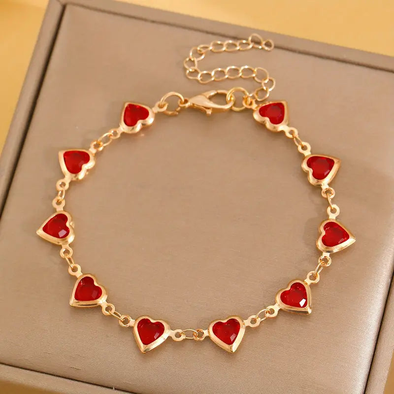 Pulsera de corazón de rubí en oro