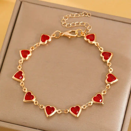 Pulsera de corazón de rubí en oro