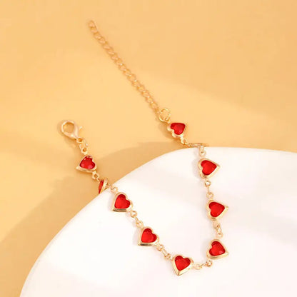 Pulsera de corazón de rubí en oro