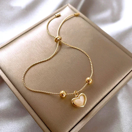 Pulsera en forma de corazón de ópalo melocotón bañada en oro