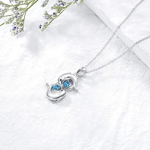 Collar de plata con doble delfín y cristal azul