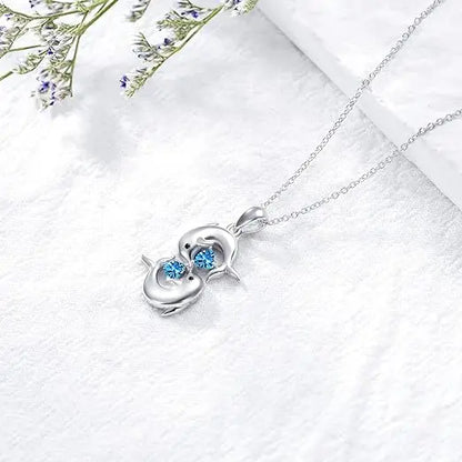 Collar de plata con doble delfín y cristal azul