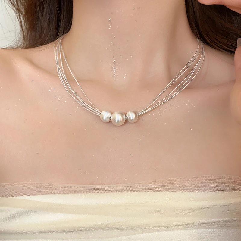 Elegante collar de capas con perla blanca