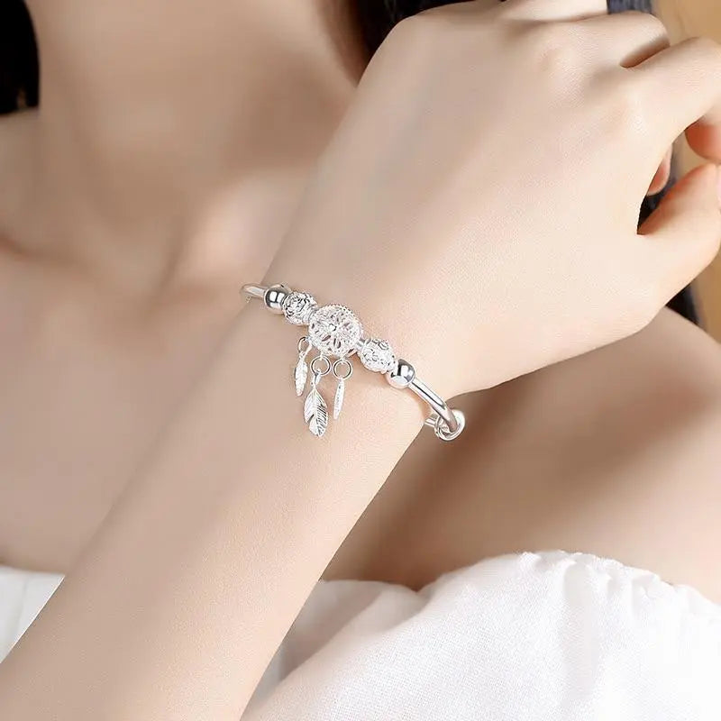 Pulsera de plata con colgante atrapasueños