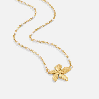 Elegante collar con flor dorada